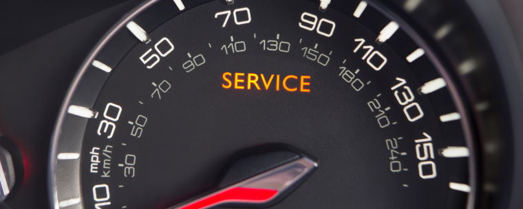 Car Dashboard Showing Service Light