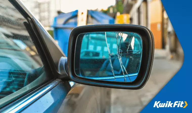 A wing mirror that has had the glass smashed