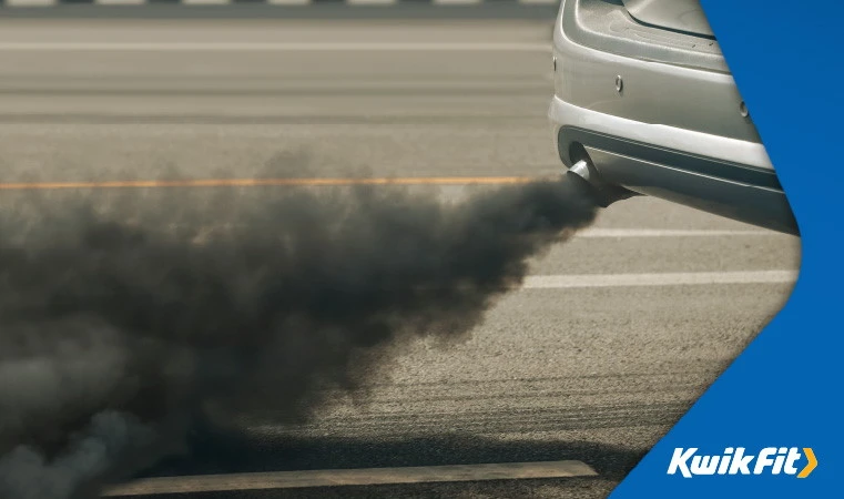 Black smoke coming from a car exhaust.