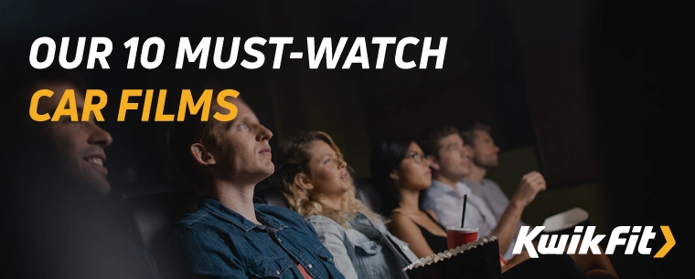 People sitting in a row at a cinema watching a film with drinks and popcorn.