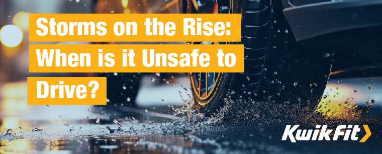 Tyres driving on a wet road with water splashing.