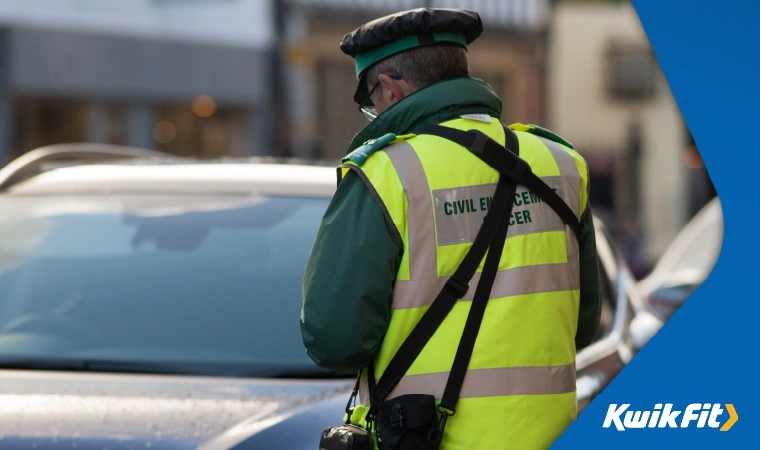 Civil Enforcement Officer issuing a parking ticket.