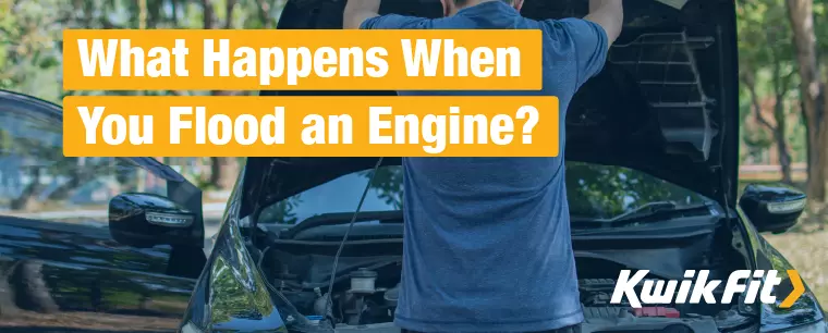 A driver opens the bonnet of their black car to help address a flooded engine.